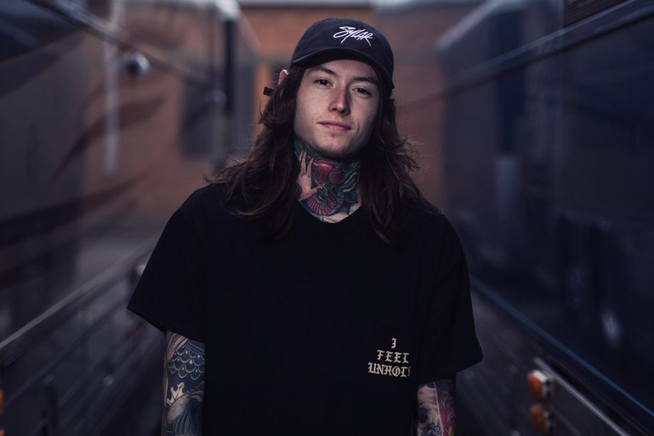 noah sebastian of bad omens photoshoot by bryan kirks wearing black tshirt and cap 920x613 1 - DaBaby Store